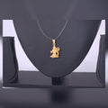 Gold-Tone Figurine Pendant Necklace — view A