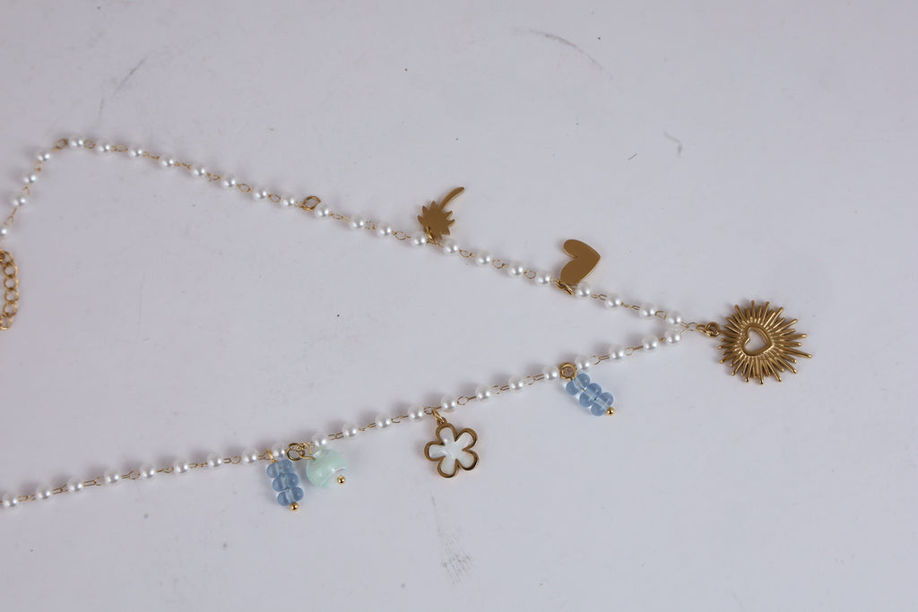 Pearl Necklace with Golden Heart Sunburst Pendant