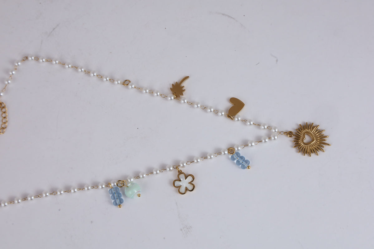 Pearl Necklace with Golden Heart Sunburst Pendant