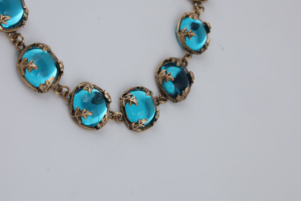 Gold-Tone Turquoise Statement Necklace with Artistic Stone Detailing