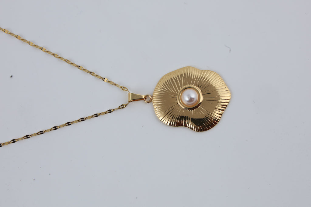 Gold Tone Sunburst Pendant with Pearl Accent