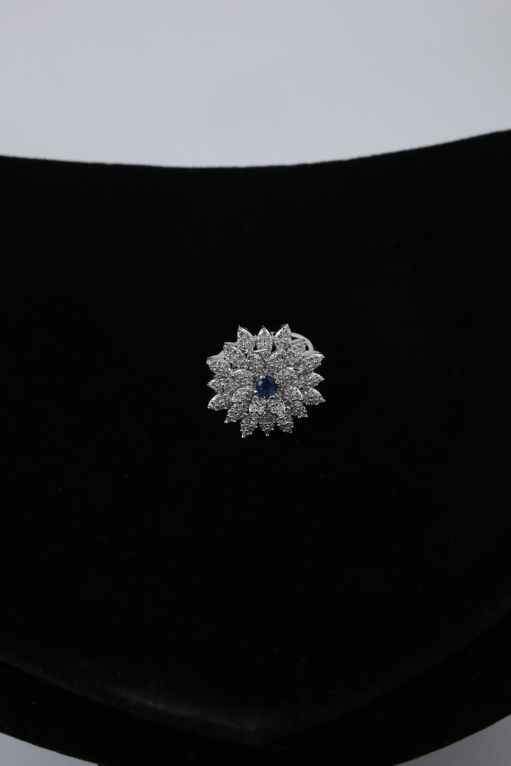 Silver Tone Floral Ring with Blue Centre Stone