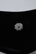 Silver Tone Floral Ring with Blue Centre Stone