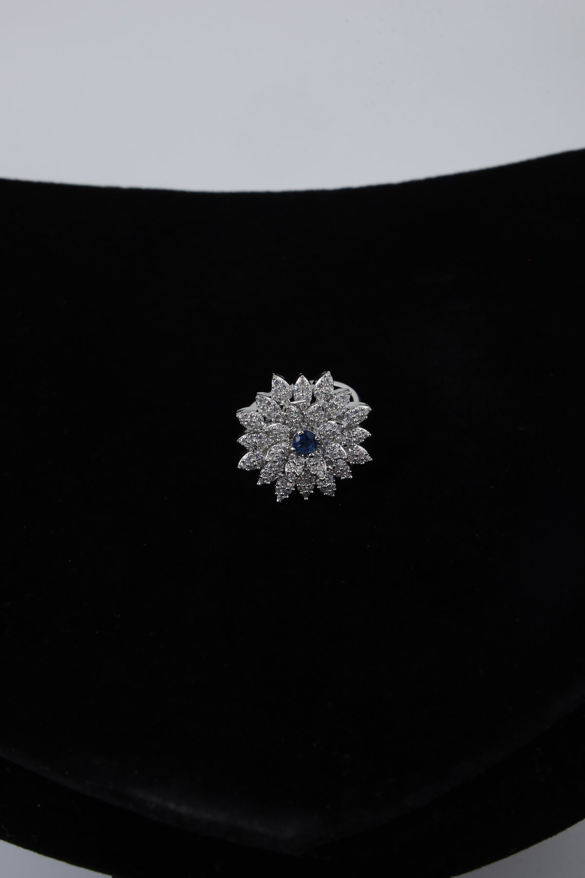 Silver Tone Floral Ring with Blue Centre Stone