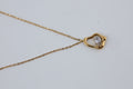 Geometric Gold Tone Pendant Necklace