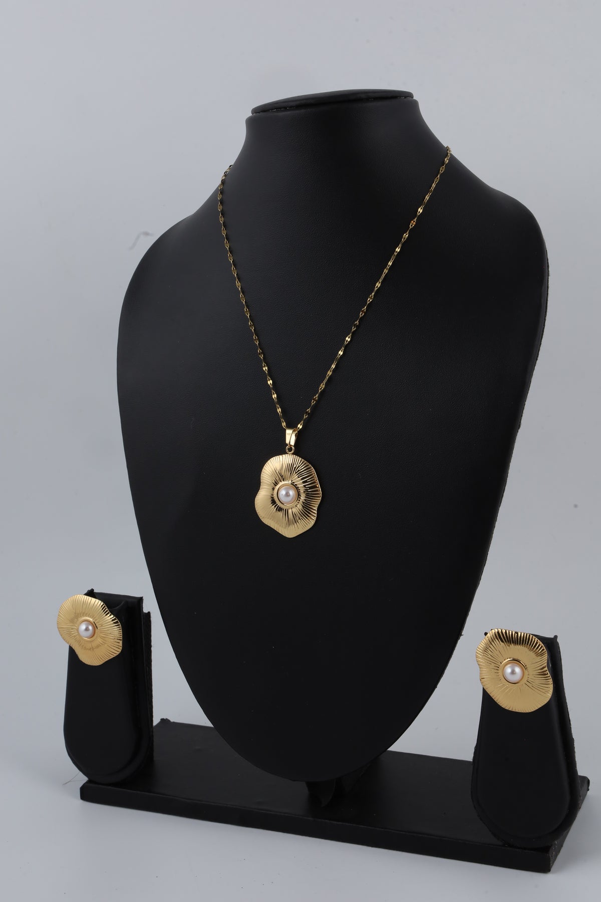Gold Tone Sunburst Pendant with Pearl Accent