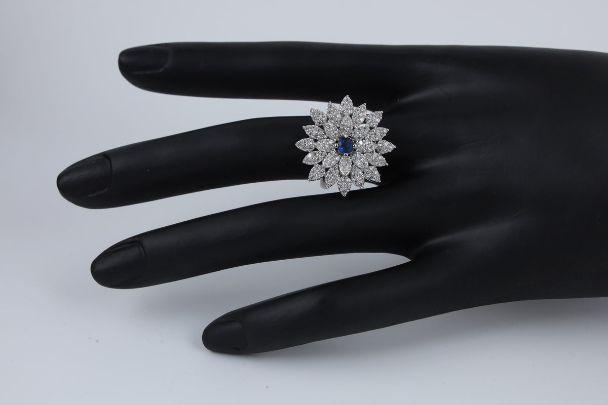 Silver Tone Floral Ring with Blue Centre Stone