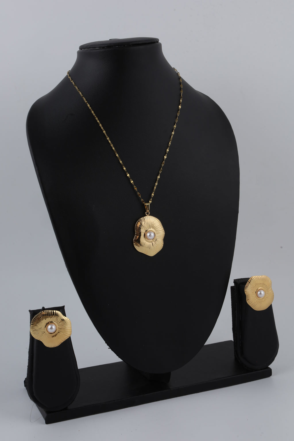 Gold Tone Sunburst Pendant with Pearl Accent