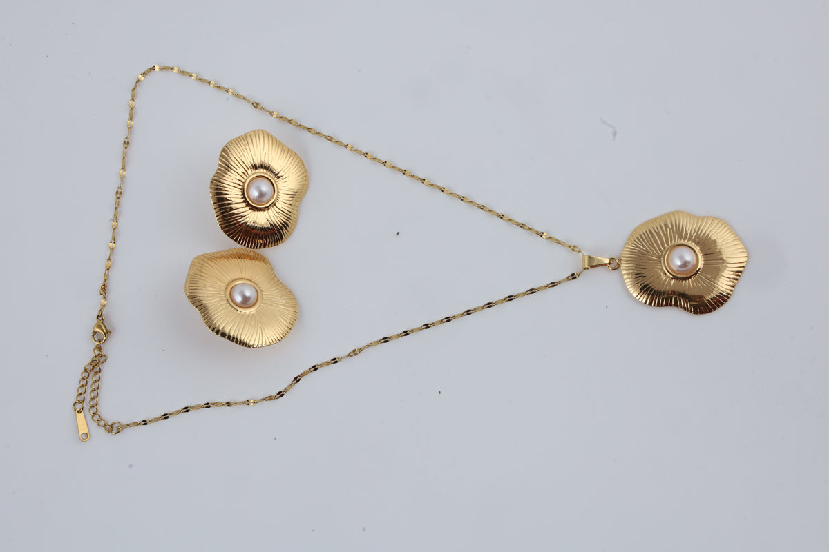 Gold Tone Sunburst Pendant with Pearl Accent