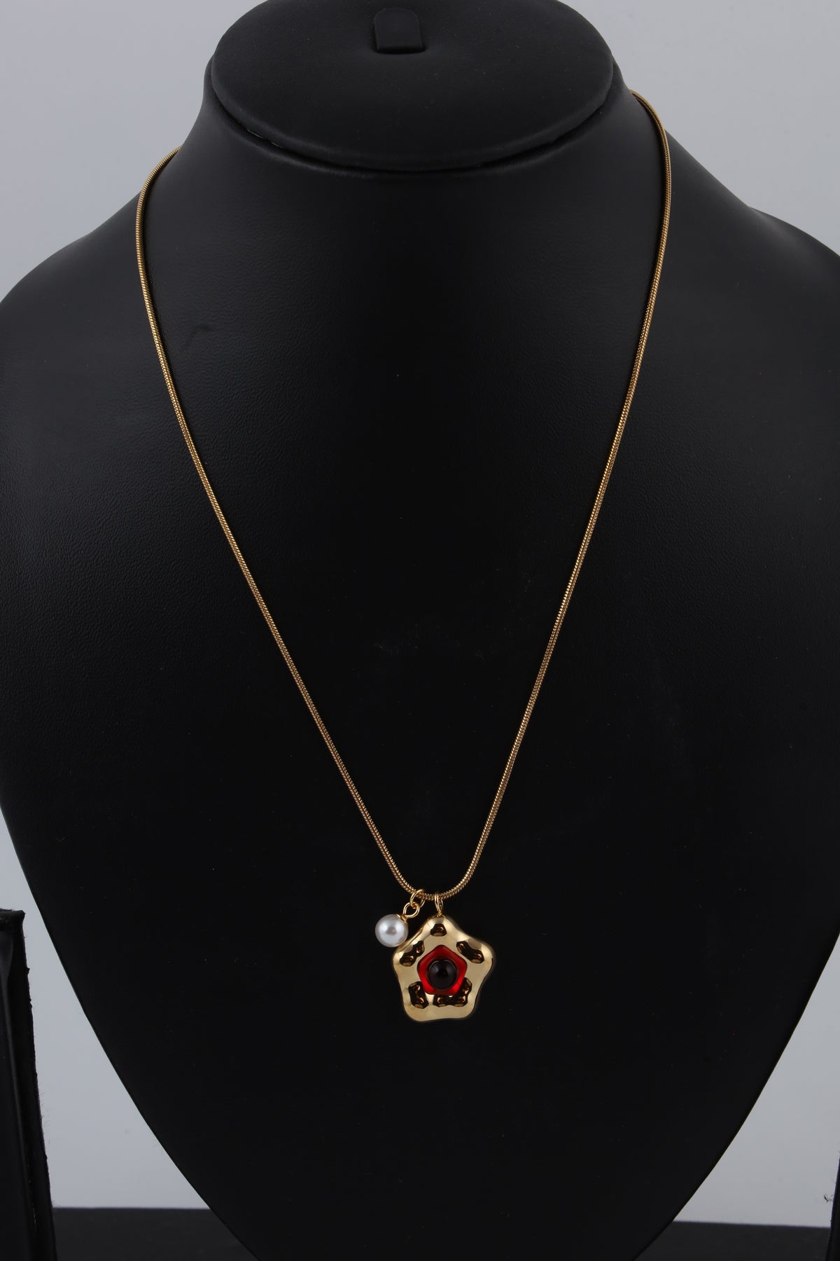 Red Stone Gold Tone Pendant Necklace