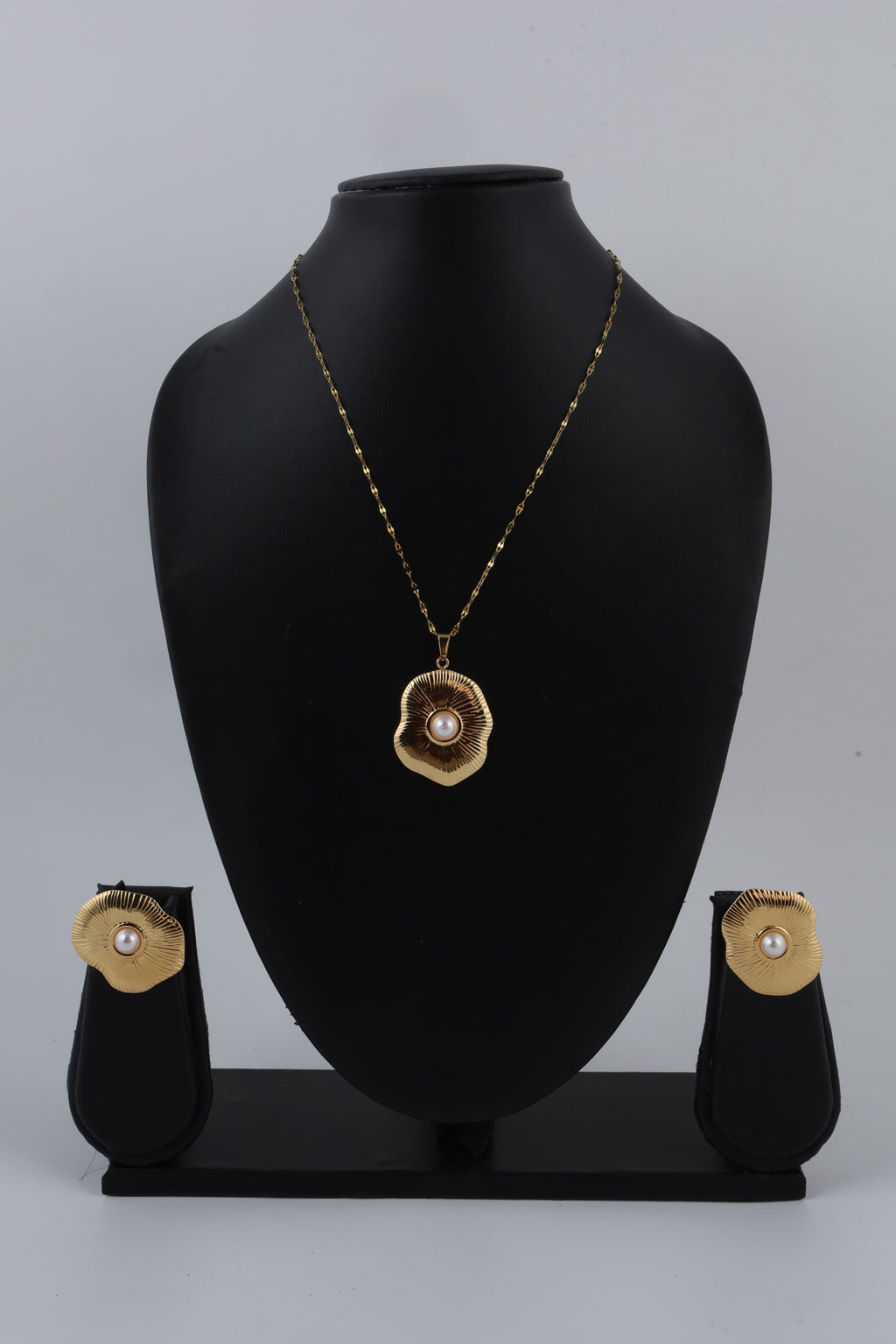 Gold Tone Sunburst Pendant with Pearl Accent